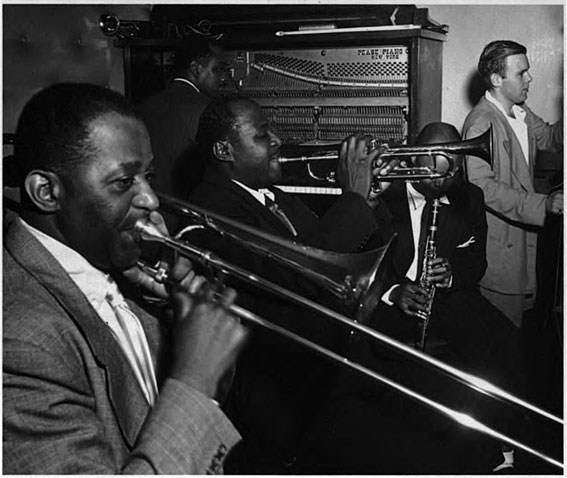 Wilbur De Paris tb), Sammy Price (p), Sidney De Paris (tp), Eddie (Emmanuel) Barefield (cl) and Charlie Traeger (b),  Jimmy Ryan's Club, New York, N.Y., ca. July 1947  © William P. Gottlieb/Ira and Leonore S. Gershwin Fund Collection, Music Division, Library of Congress by courtesy